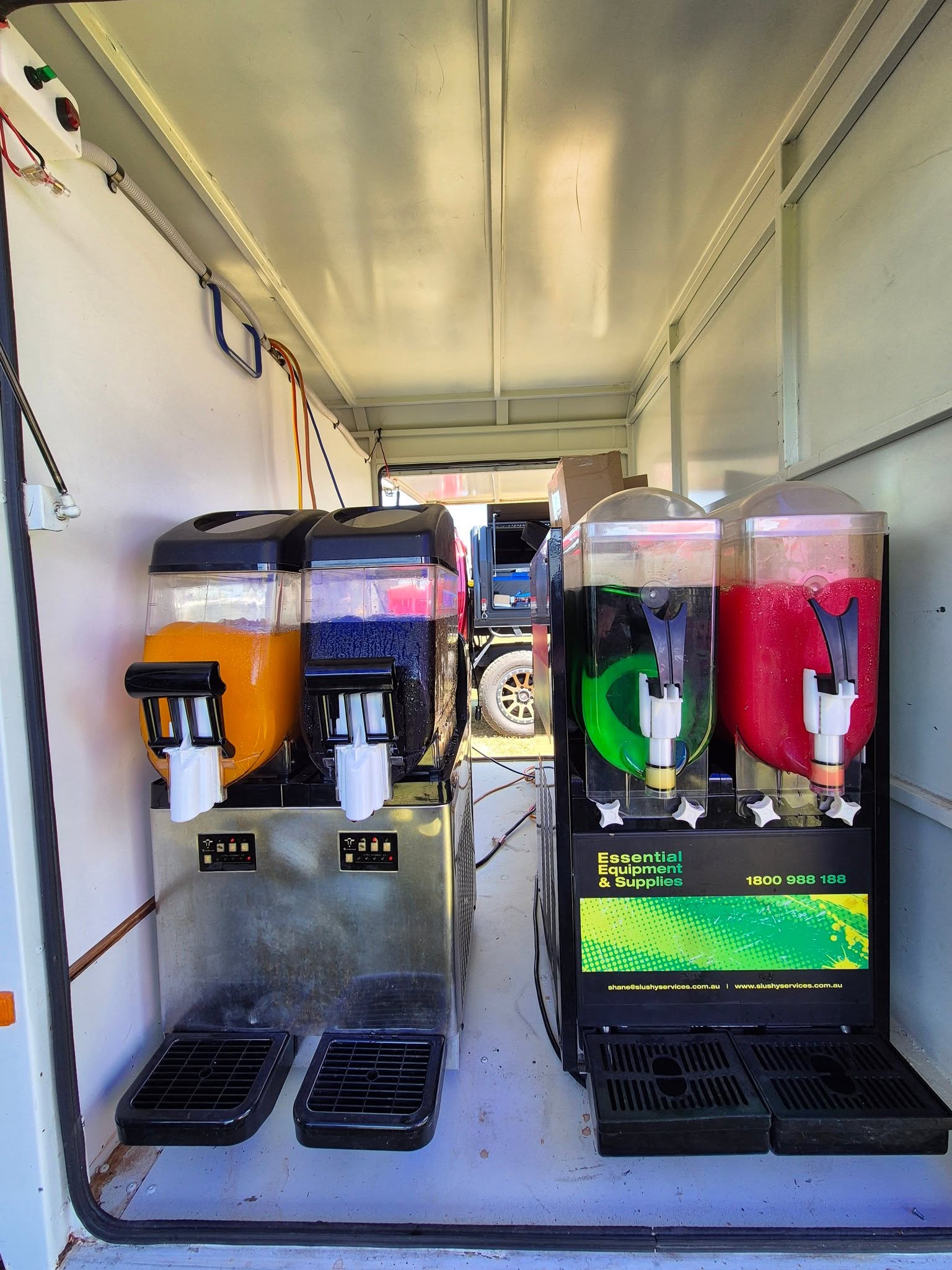 Four colourful slushie machine bowls